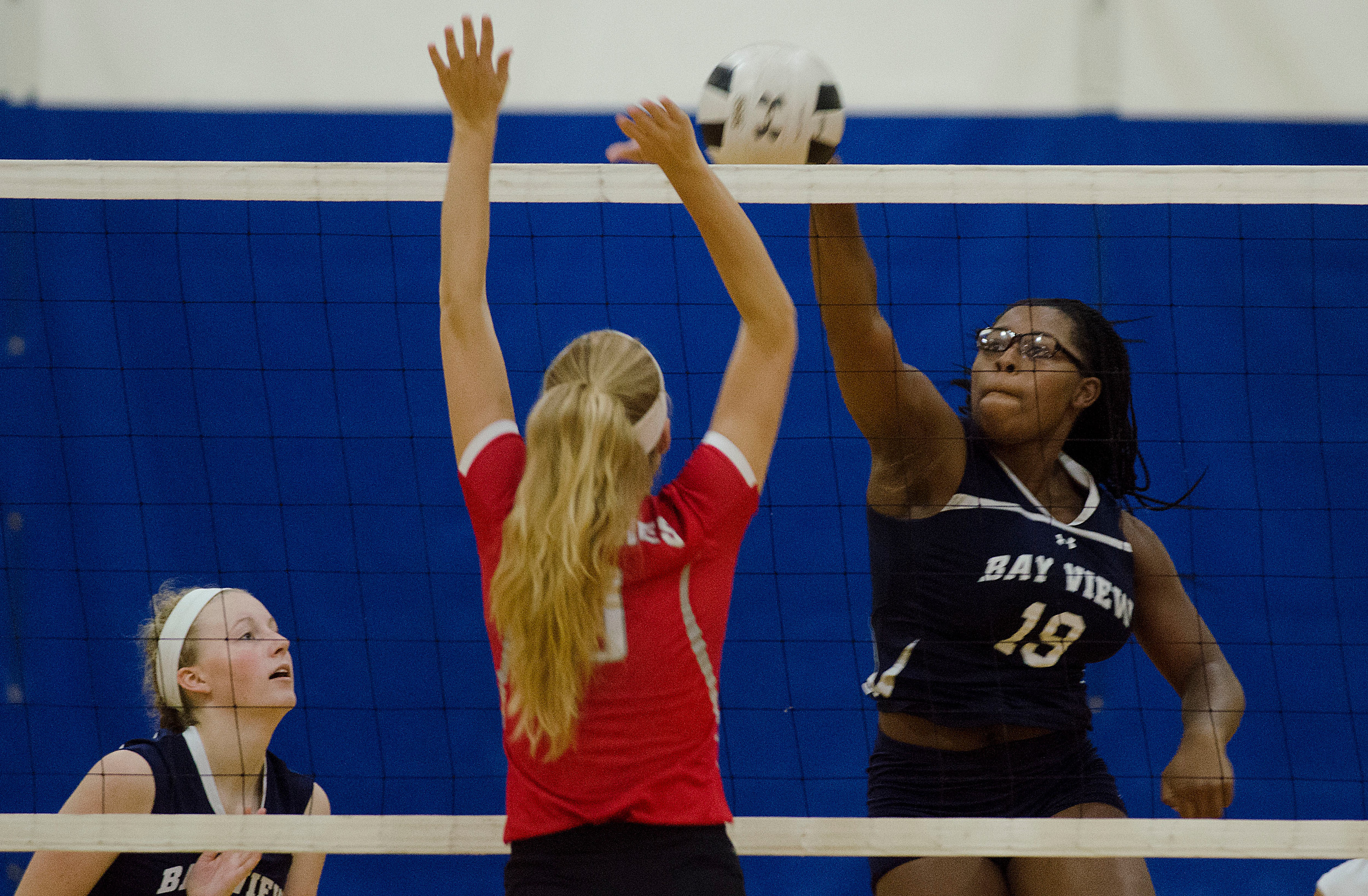 Bay View's Alexa Brooks-Major poke's a volley by the Townies.