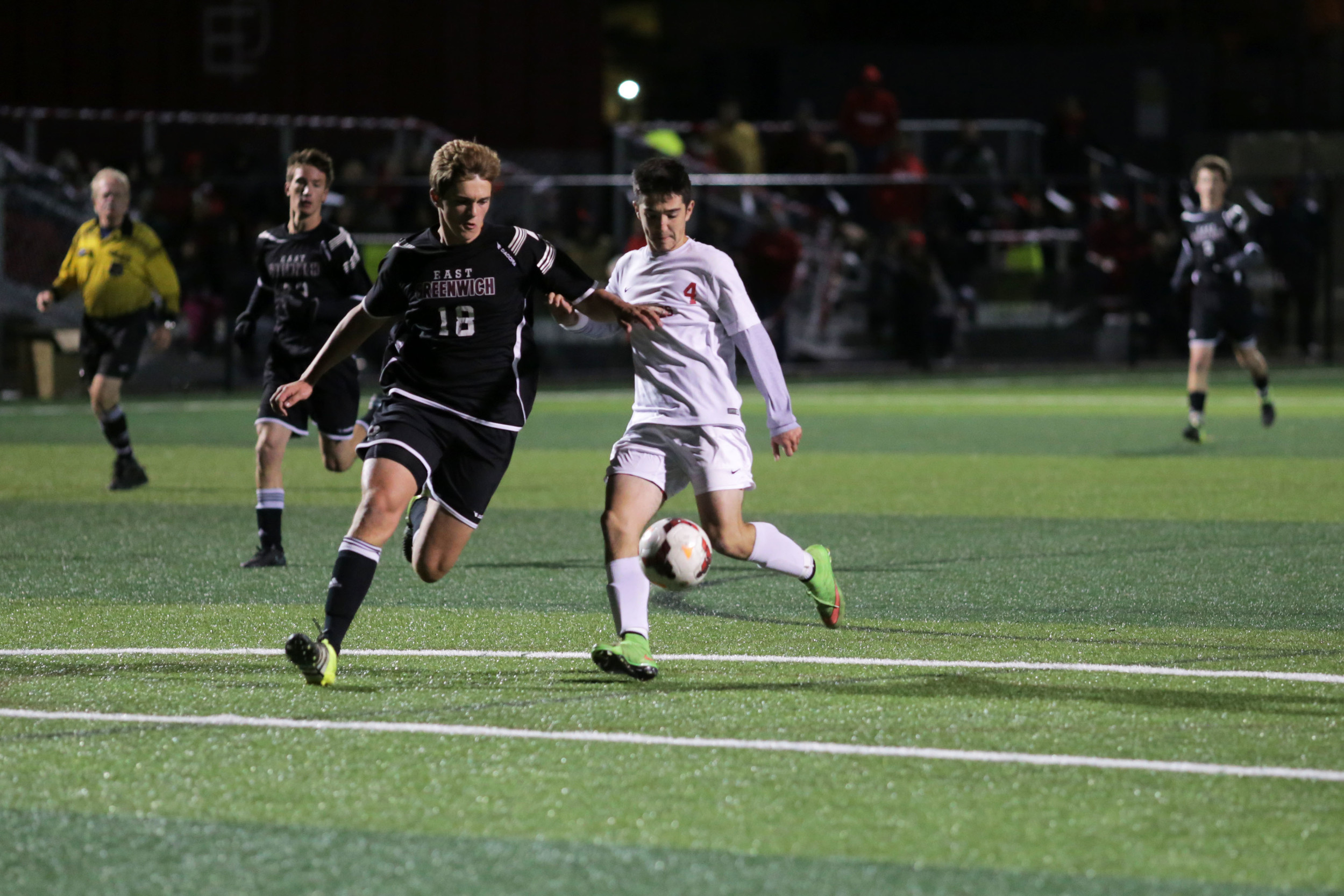 East Providence's Nathan Bento battles for control of the ball with a East Greenwich opponent.