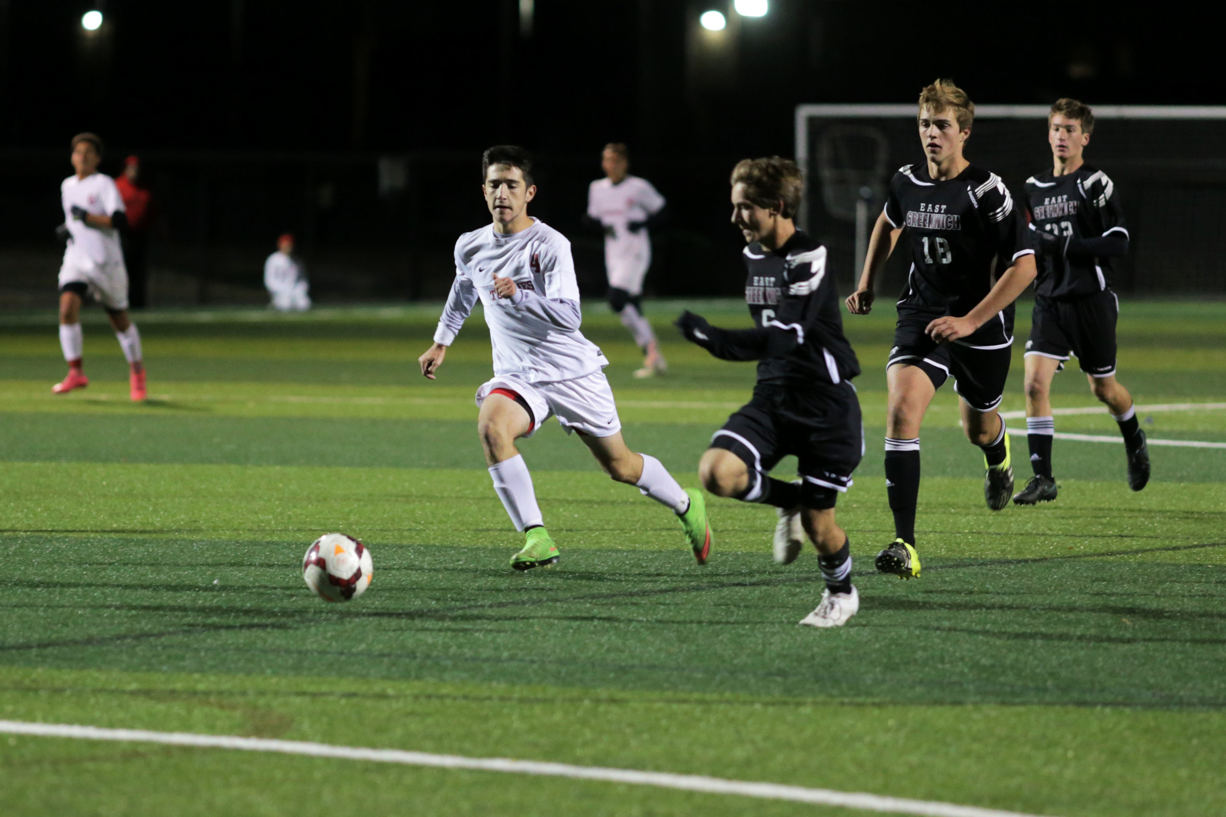 East Providence's Nathan Bento outruns East Greenwich defenders to take a shot on net.