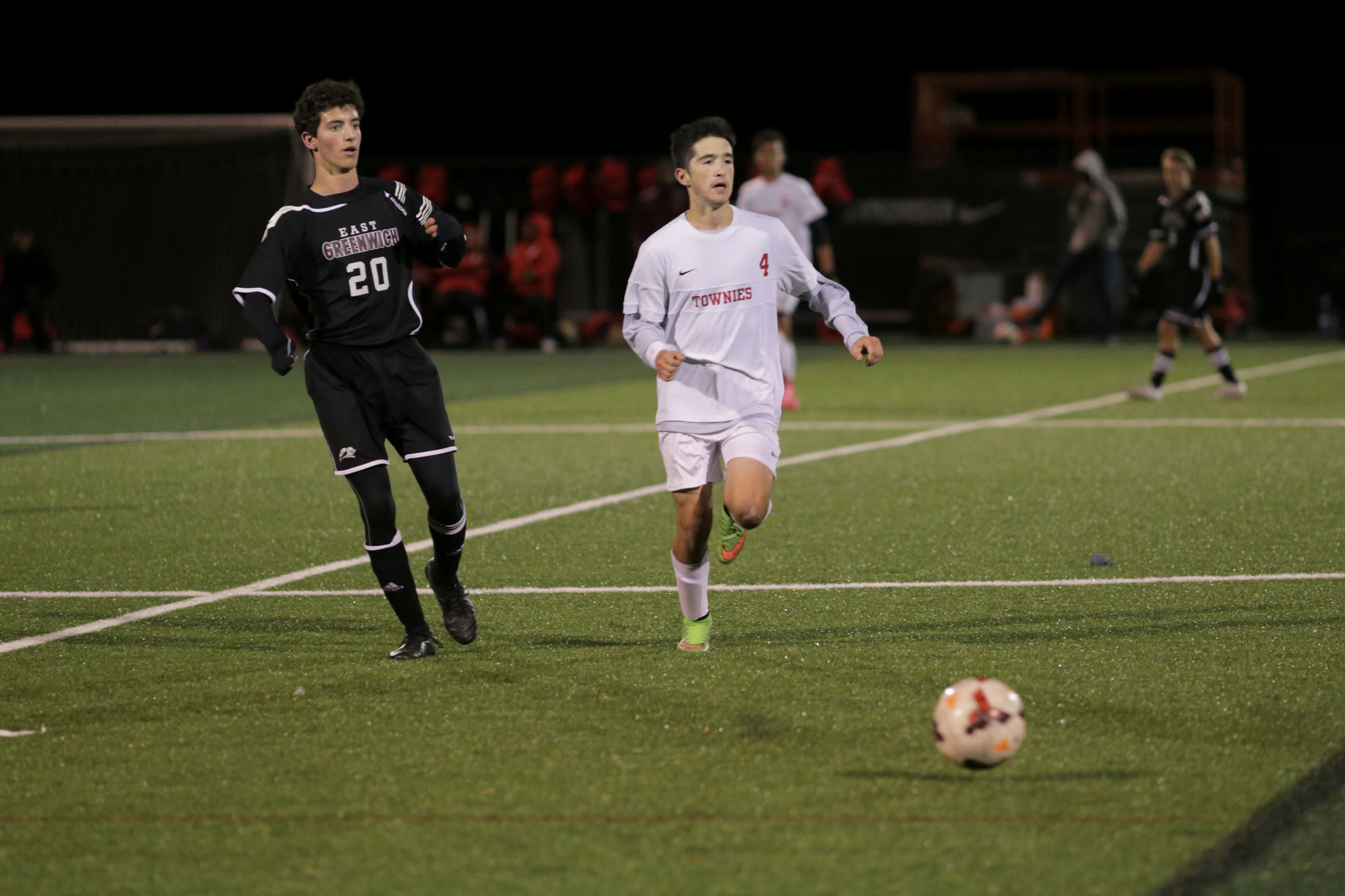 East Providence's Nathan Bento races the keep the ball in bounds at midfield.