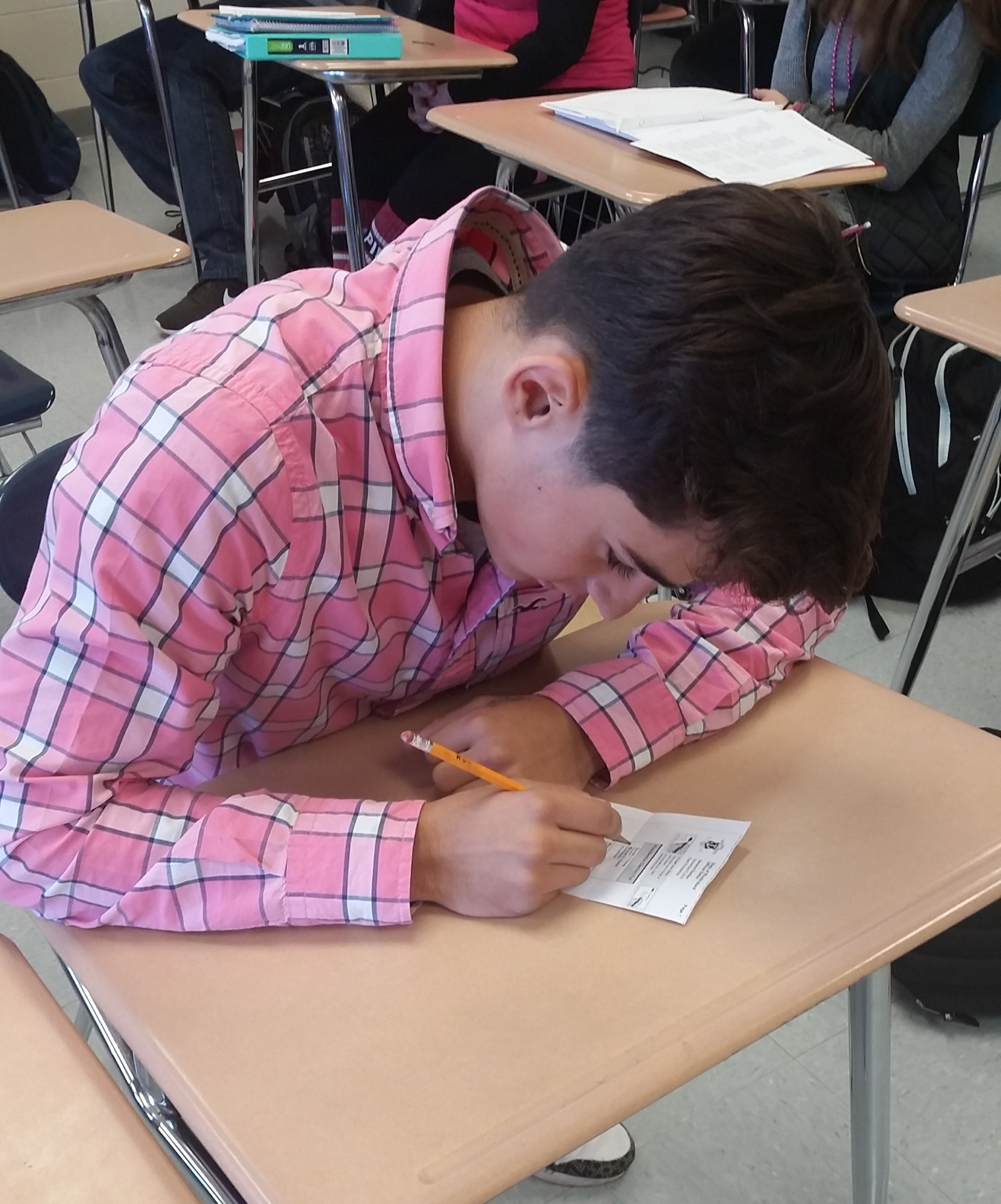 EPHS student Cameron Farias fills out his ballot during the mock presidential election held Wednesday, Oct. 26.