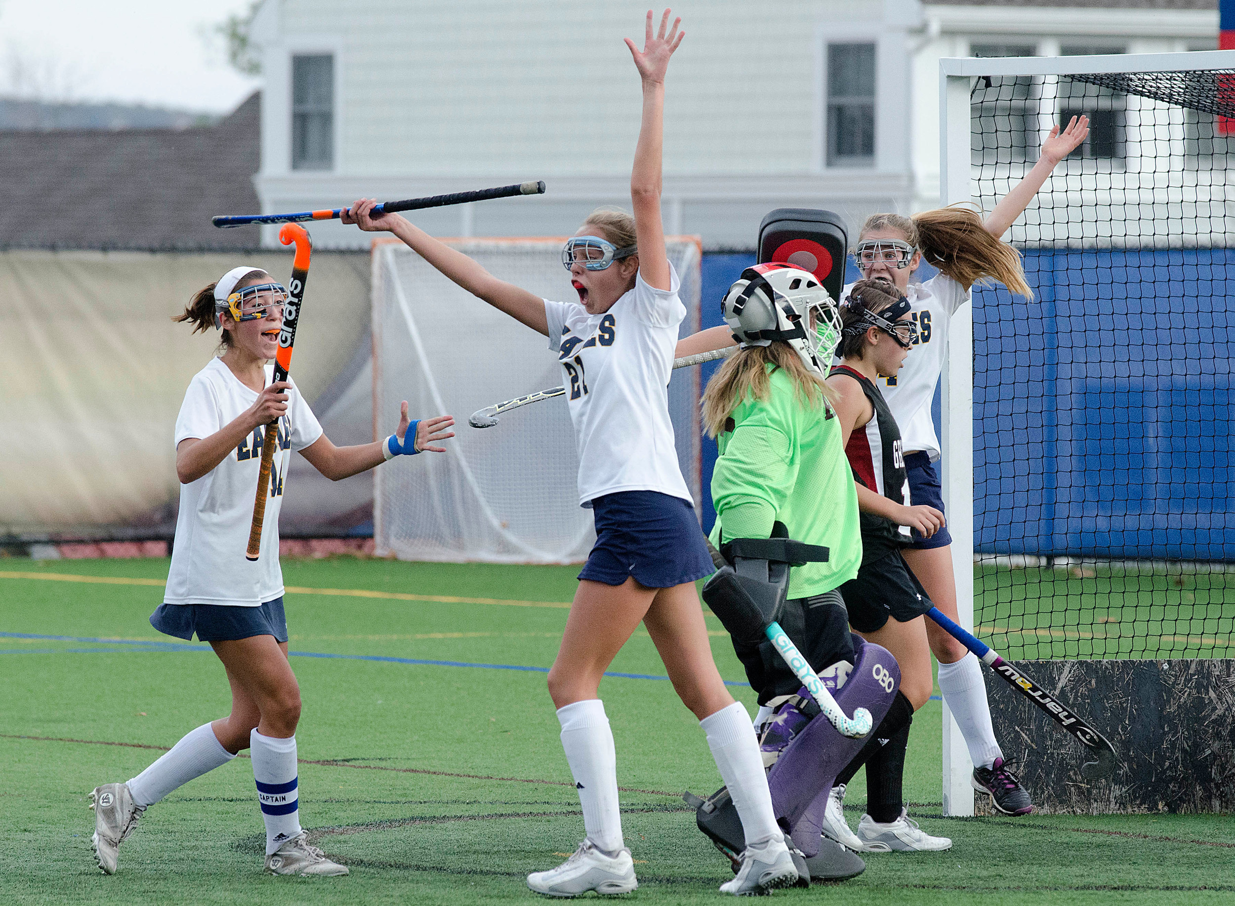 Eagles celebrate from left, Lily Gagliano, Lillyanne Dunphy and Alexy Carolyn after teammate Maddy Cox scored to knot the game at 1-1.