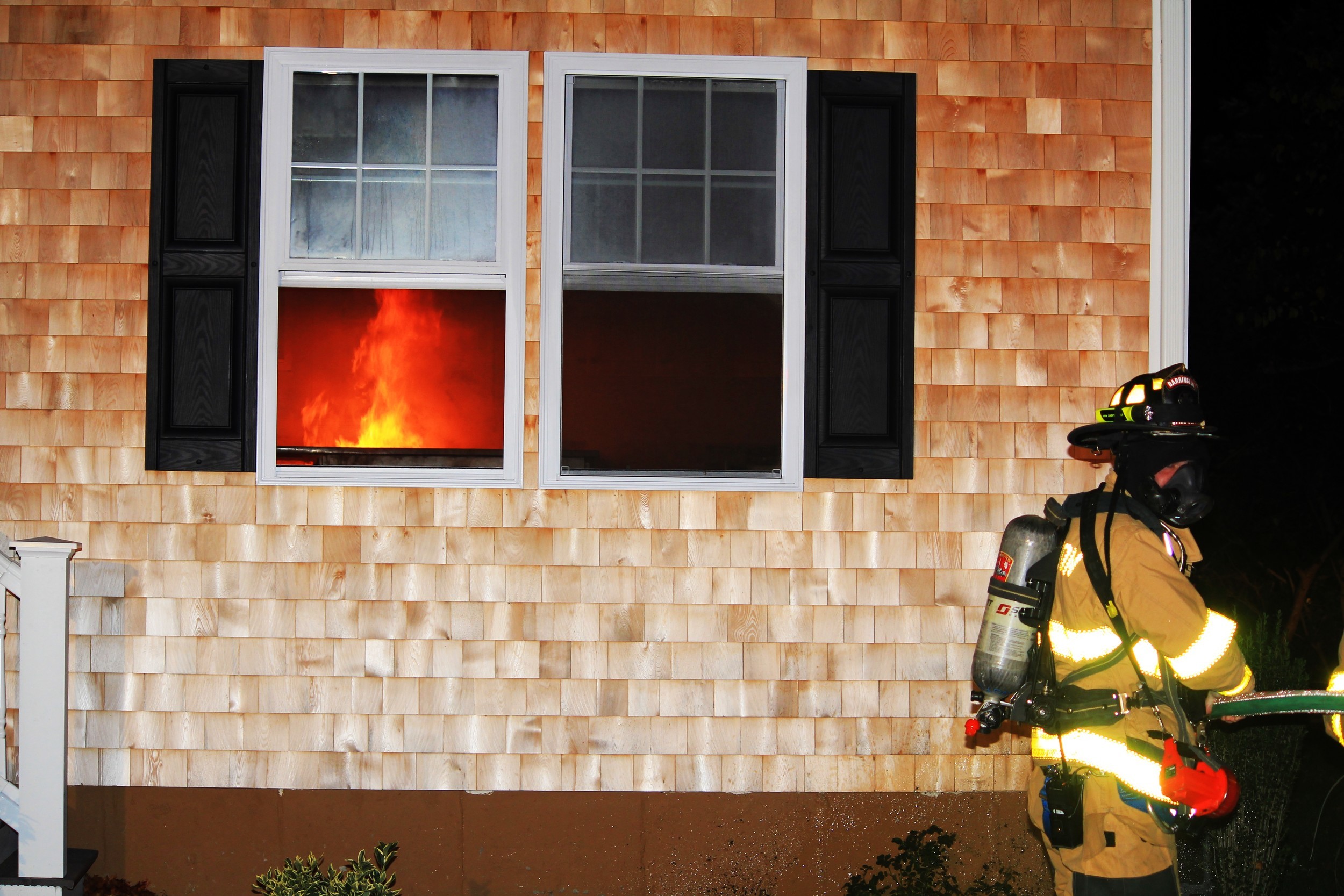Flames can be seen inside the home at 2 Northwest Passage on Wednesday night, Nov. 2.