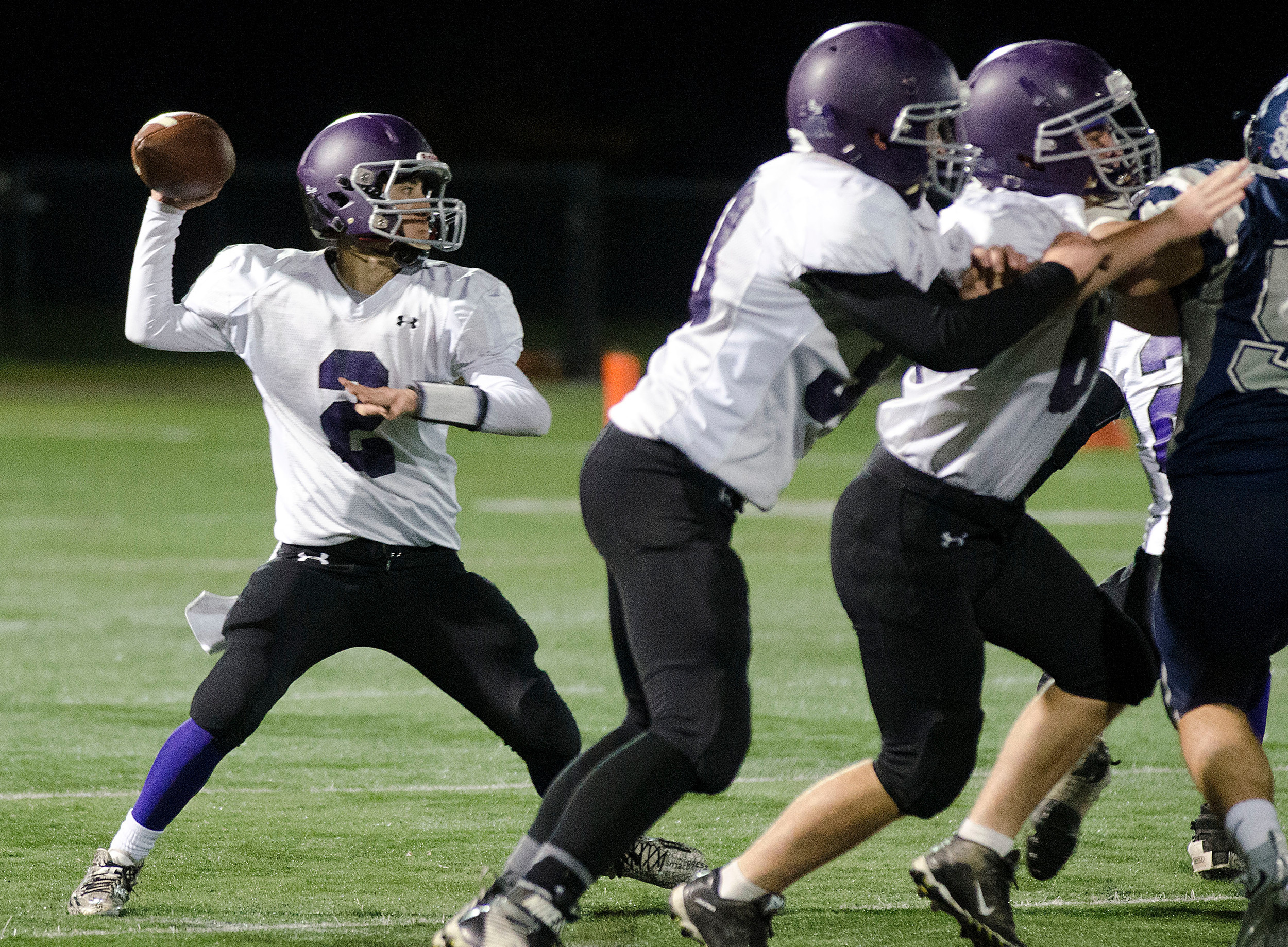 Huskies quarterback Vincent Berretto looks to pass down field in the second half.
