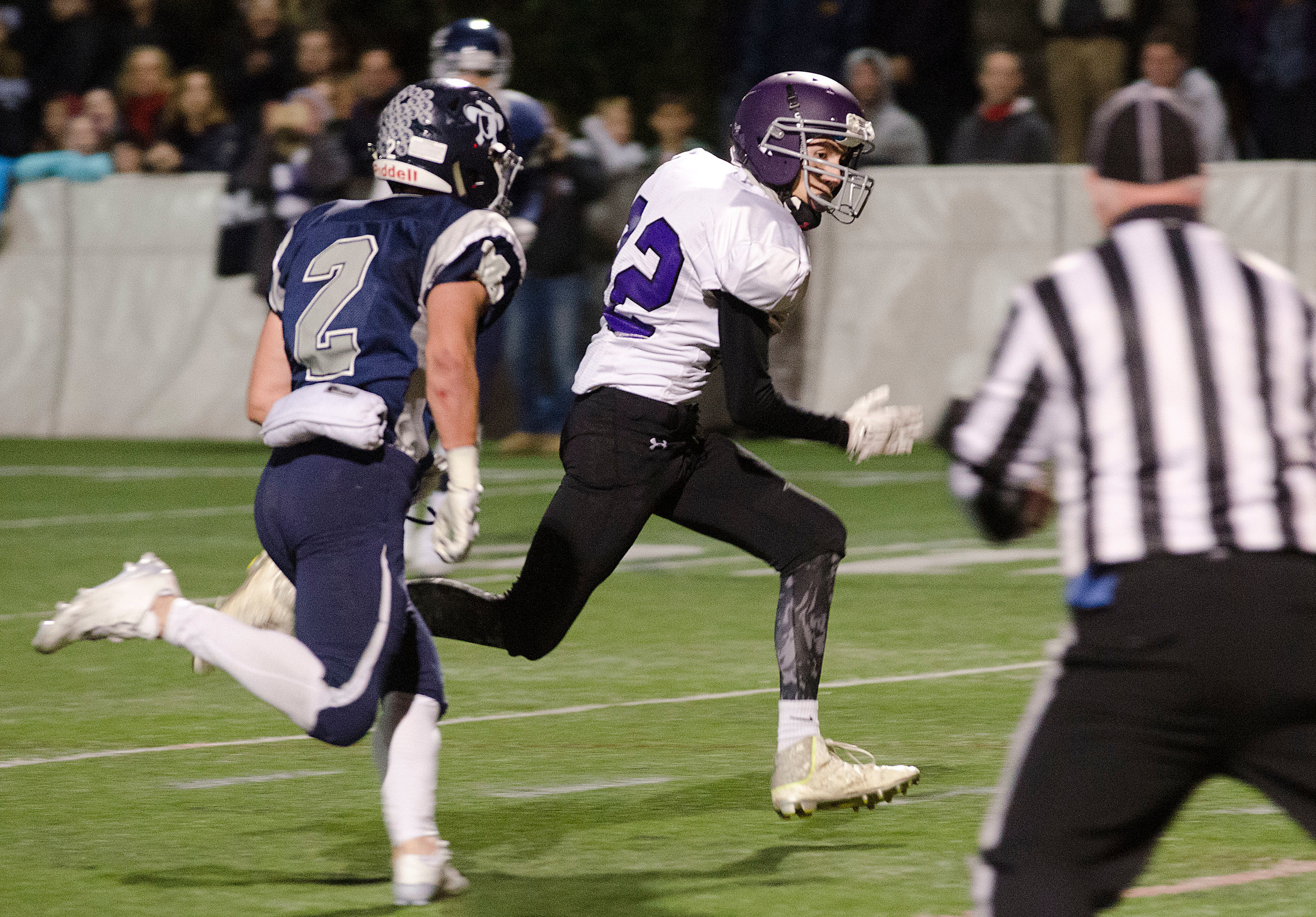 Huskies receiver Zach Burke runs to the end zone for a touchdown after catching a pass from quarterback Vincent Berretto in the first quarter.