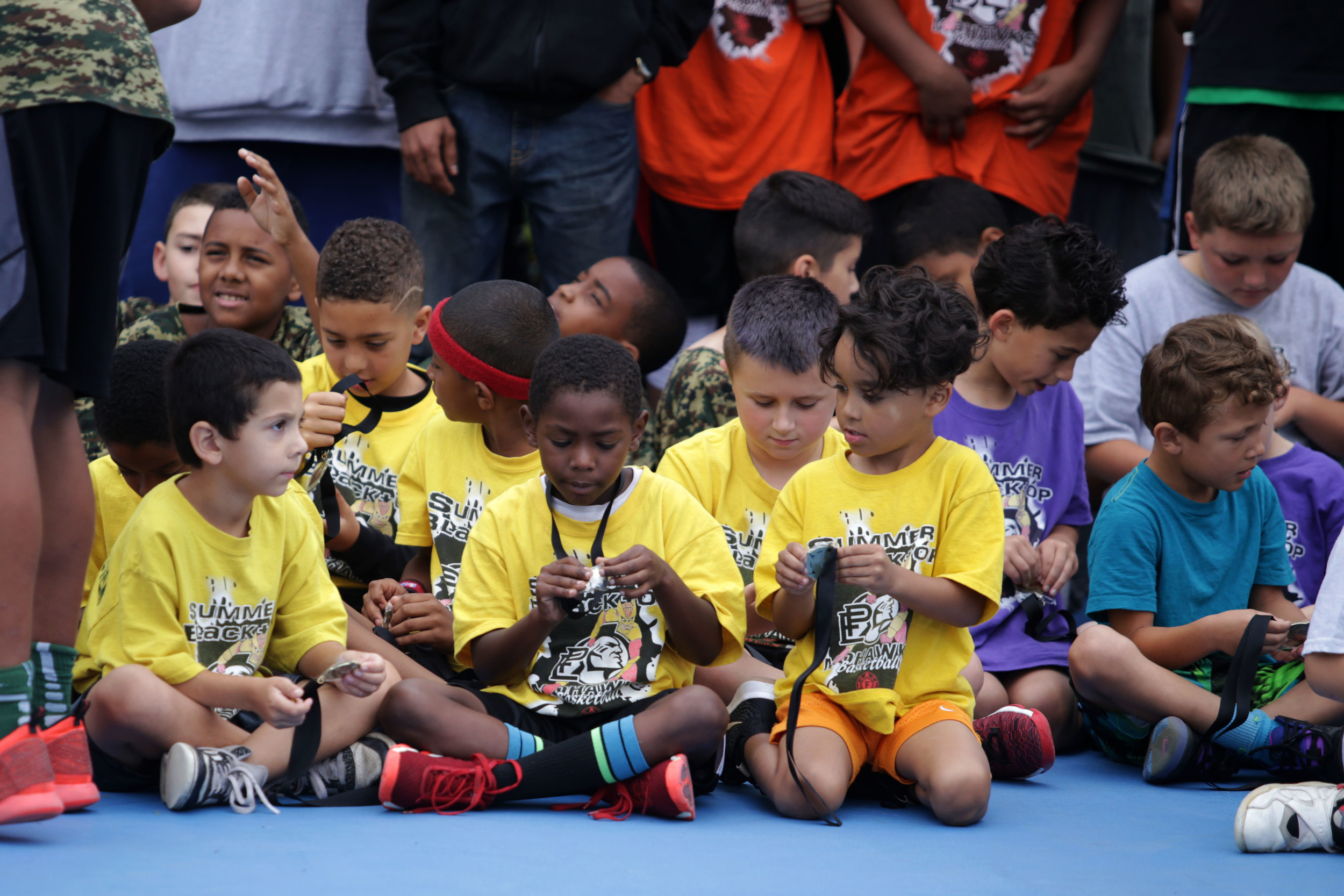 Mohawk Tiny Ballers from the K through 3rd grade division are awarded medals after competing.