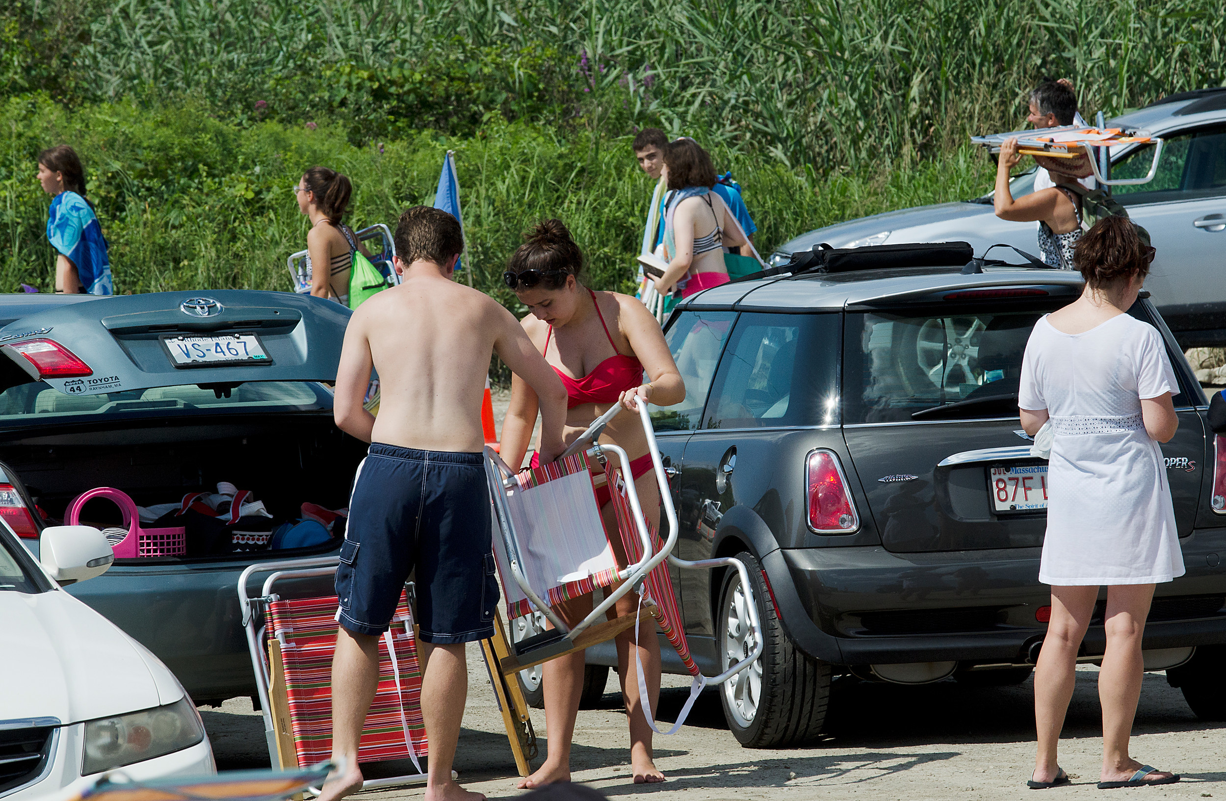 Beach goers pack up as police close the beach due to the huge surf that Gert created combined with the high tide. Waves were covering the beach and spilling into the parking lot.
