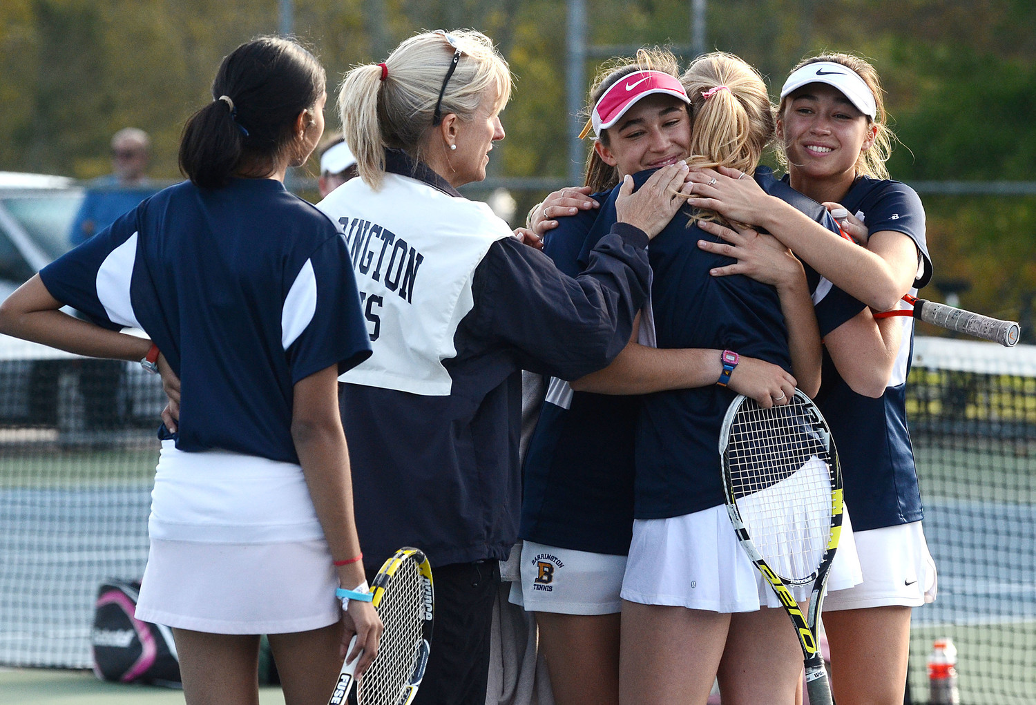 From left, Rayna Mishra, coach Christine Barton, Abigail Walter, Hope Vetromile and Jillian Walter react after losing the D-I championship match to LaSalle at Slater Park on Saturday.