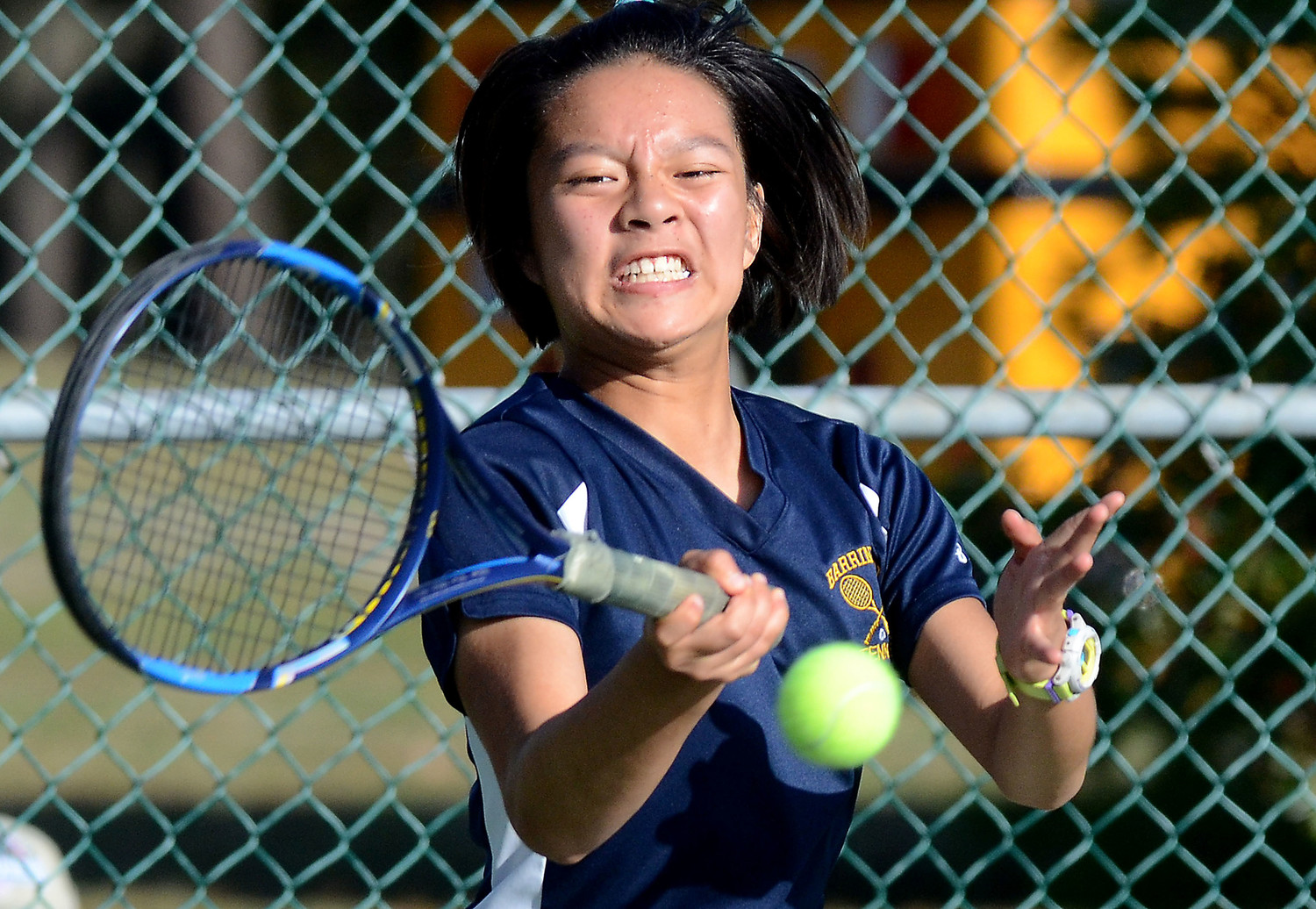 Elizabeth Wang hits a forehand during her match.