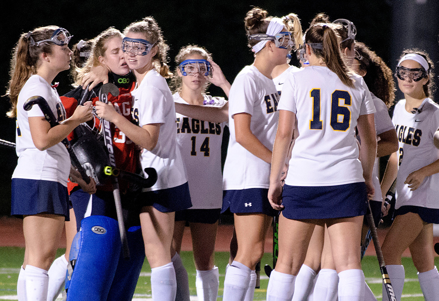 The Lady Eagles console goalkeeper Caileigh Durkin after the loss to North Kingstown in the Division I semifinals.