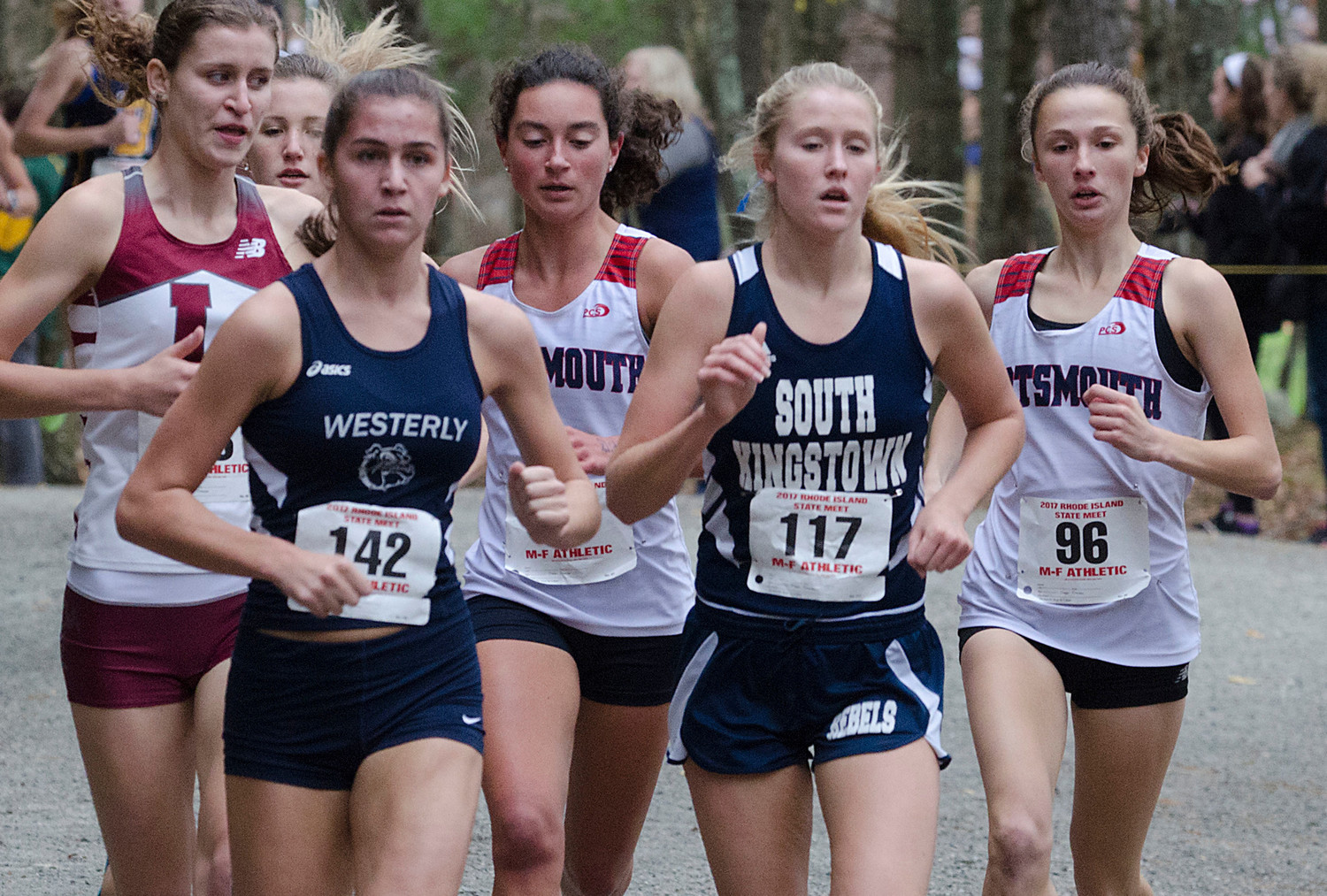 Cross country stars from left, Emily Kane of LaSalle, Randi Burr of Westerly, Elizabeth Sullivan of Portsmouth, Eleanor Lawler of South Kingstown and Nikki Merrill of Portsmouth run in a tight pack on the wooded part of the course at Ponaganset on Sunday.