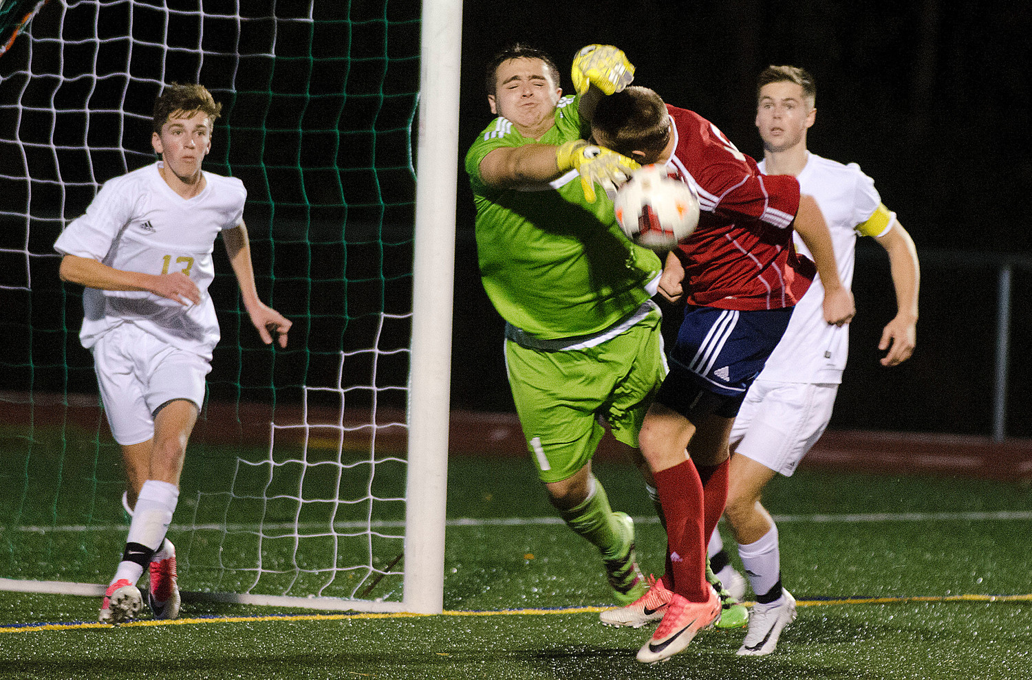 Morel grabs Christian McNeilly and the ball during a Pats corner kick.