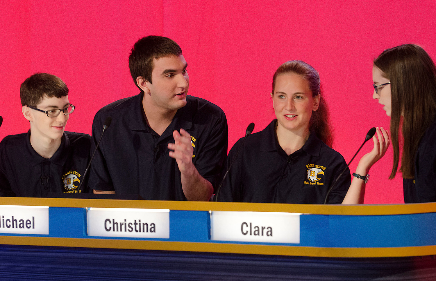 Members of the Barrington High School team (from left to right) Daniel Sheinberg, Michael Lamontagne, Christina Curran and Clara Klugler confer before offering an answer during the High School Quiz Show: Rhode Island competition at the PBS studios on Saturday morning.