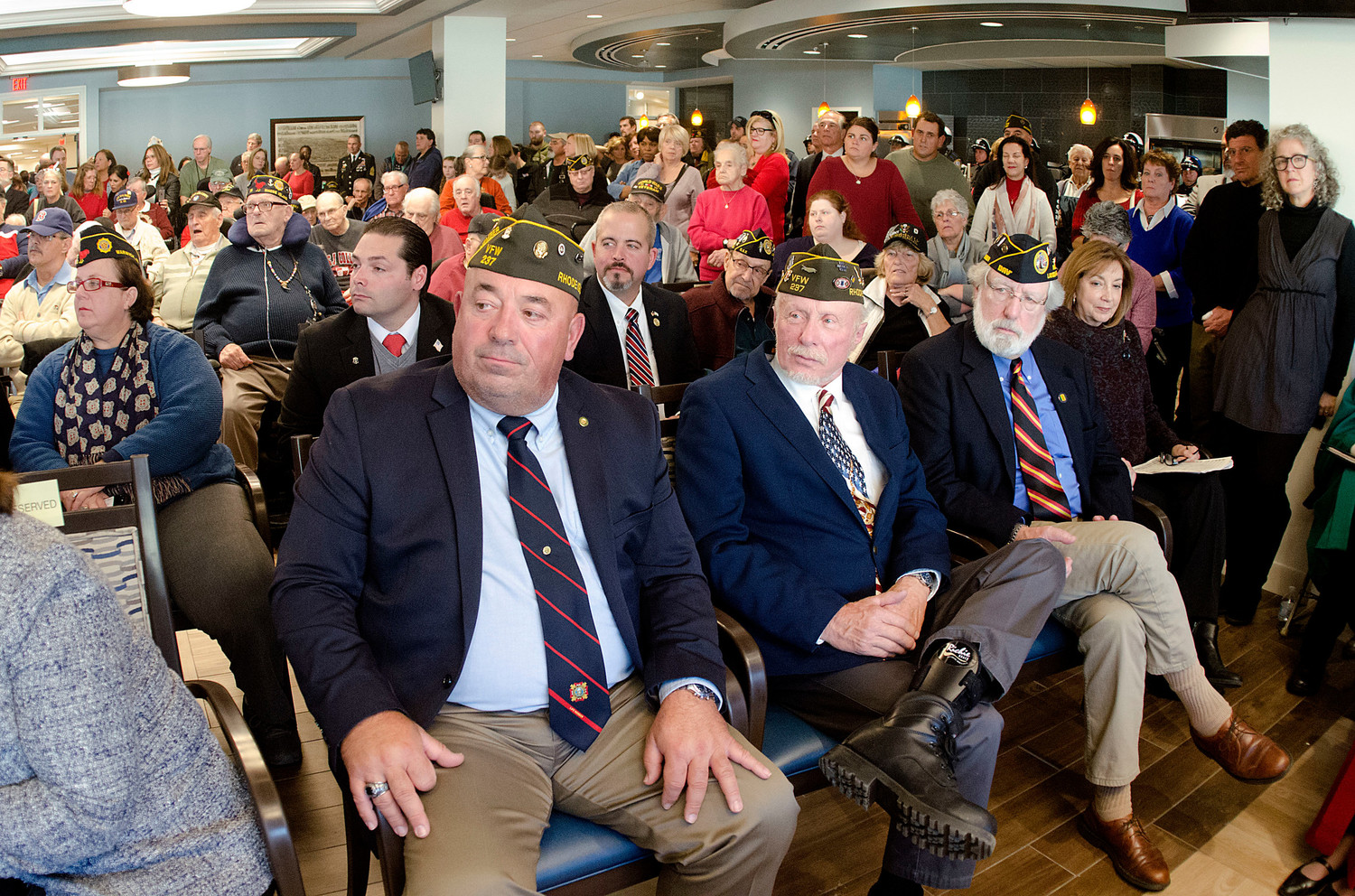 Bristol veterans council members applaud during the ceremony.