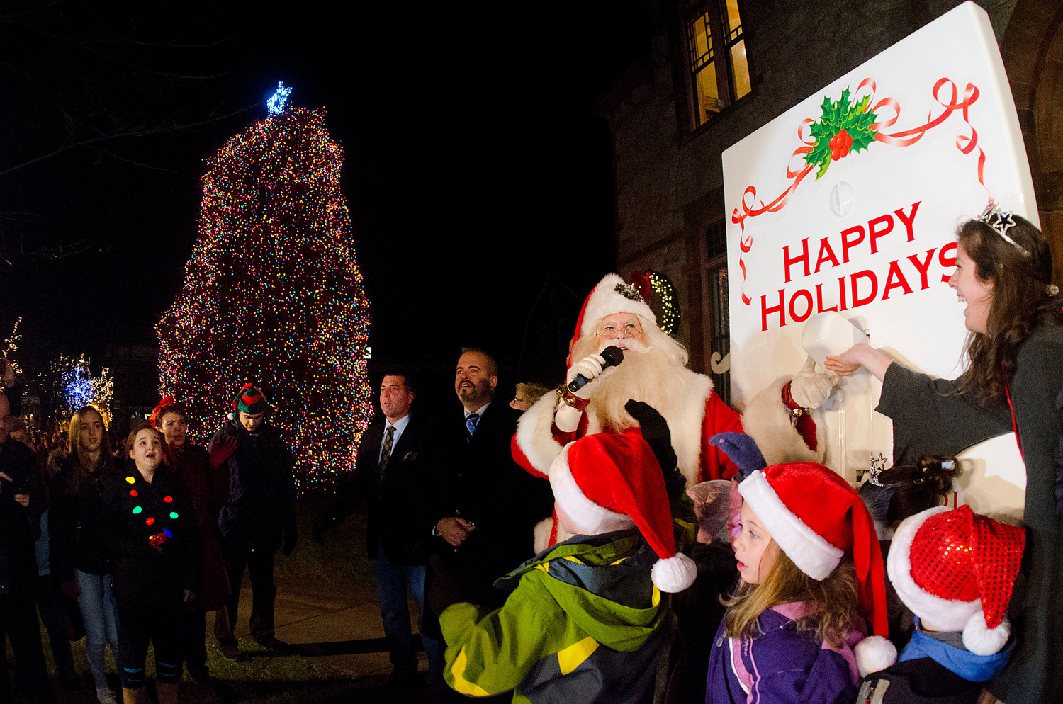 Santa and his elves, including Miss Fourth of July Olivia Borgia and Little Miss Fourth of July Angela Pirri, hit the switch and turn on the Christmas lights during the annual Grand Illumination. This year the lights were colored lights on the tree in front of the Burnside building.