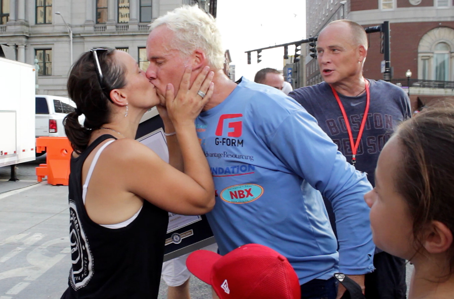Kevin gets a kiss from wife, Robin after the record breaking jump on live TV.