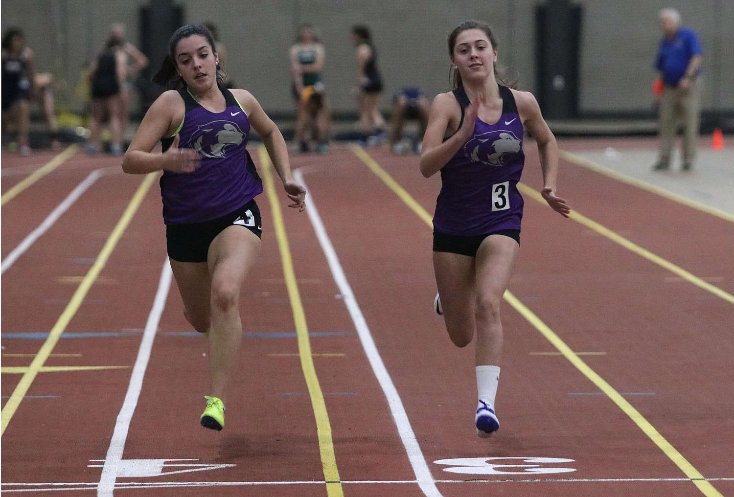 Kelsey Dias (left) and teammate, Kiley Bouchard race down the track during a 55 meter heat. Dias placed second and Bouchard placed third in the event.