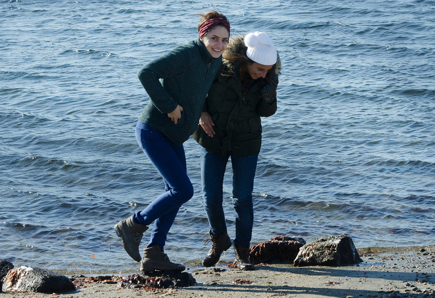 Golriz Asgari, 32, (left) and Chloe DaSilva, 27, make a polar plunge video at Grinnell's Beach.