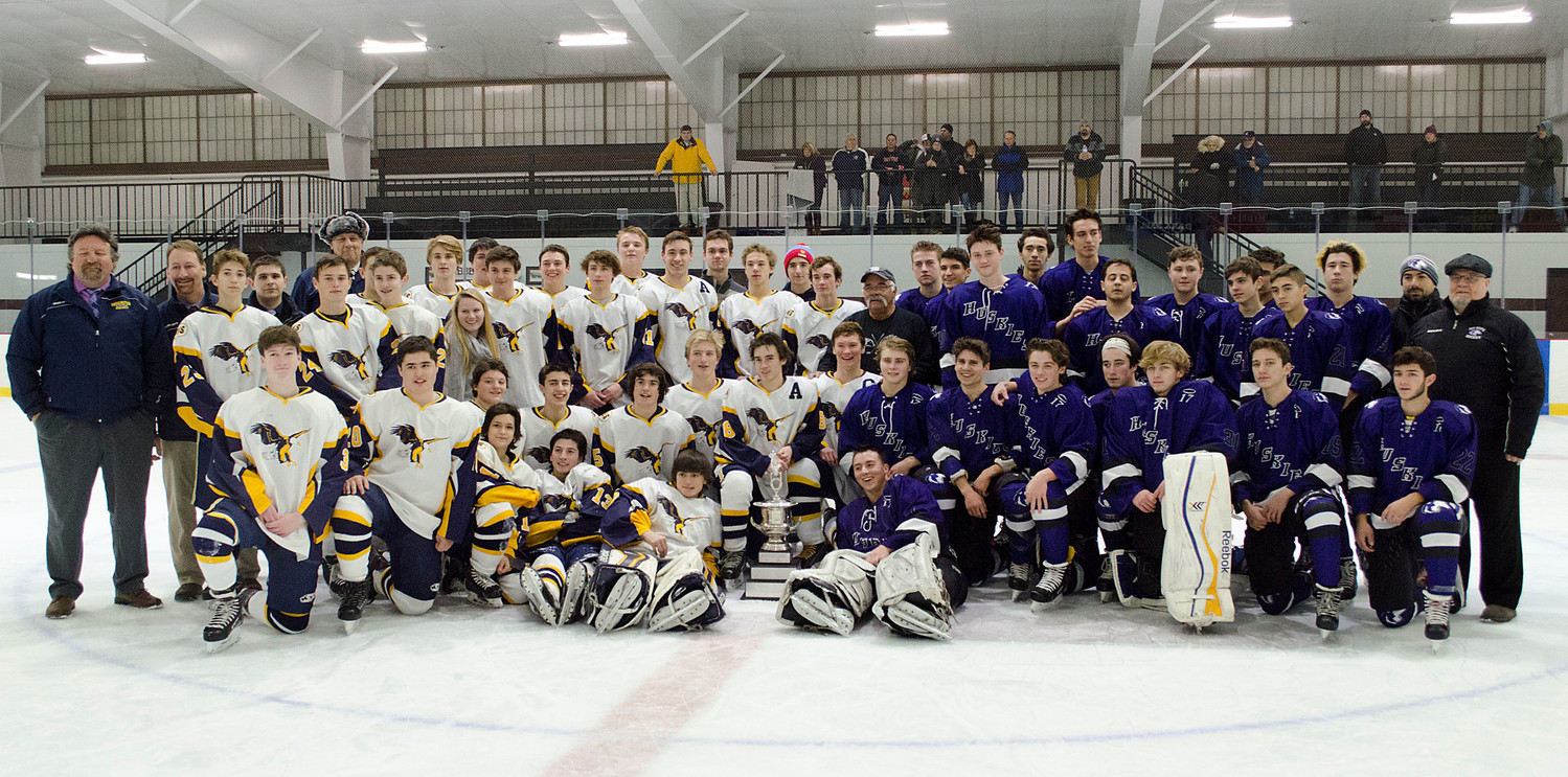 The two teams pose with JP Medeiros after the game.
