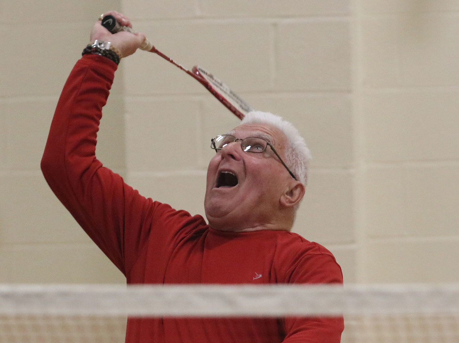 Bob Costa winds-up to slam a shot over the net during a friendly match at the Bristol Community Center on Tuesday night.