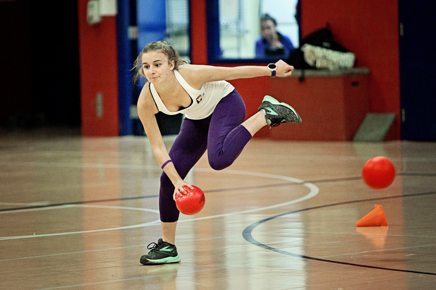 PHS junior Olive Allen, a member of the team Daughter’s of Rose, holds onto a ball while stepping over another.