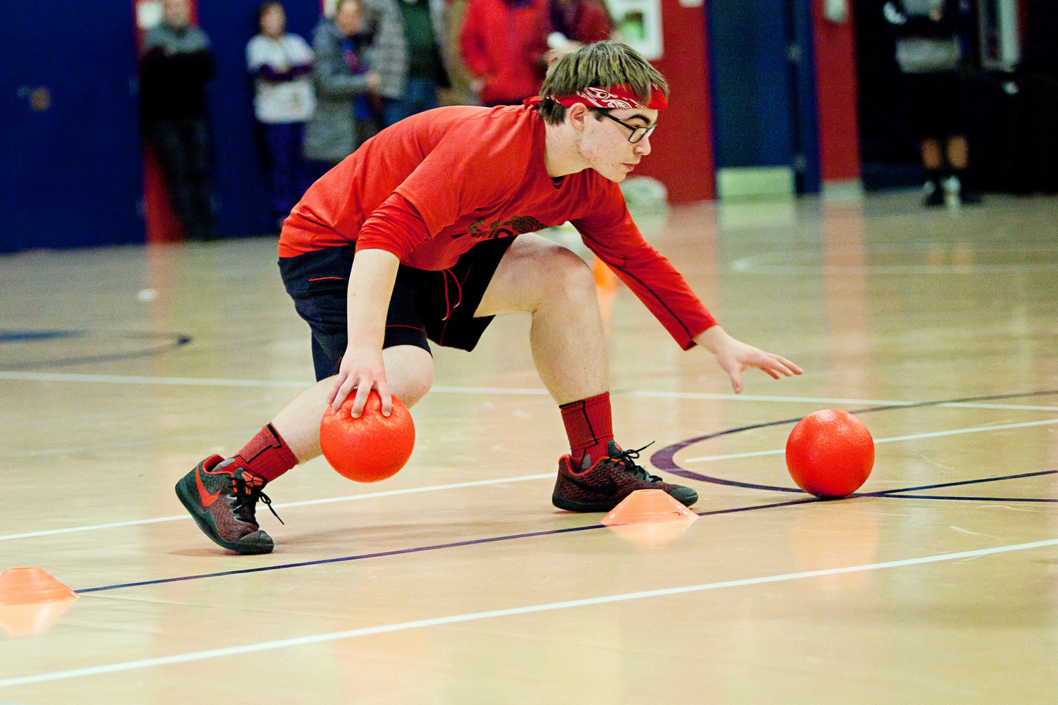 Sophomore Jacob Bloom, a member of the team Phillip Phlingers, gathers balls at the center line.
