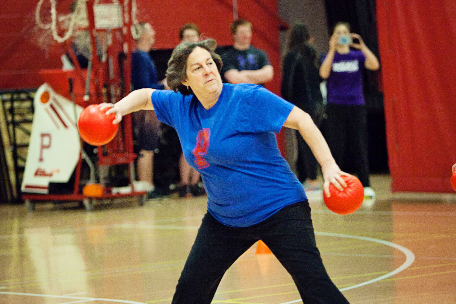 Emily Copeland, vice-chairwoman of the School Committee, hurls a ball while competing for The Hard Targets.